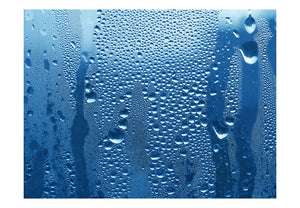 Fotobehang - Water druppels op blauw glas